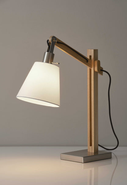 Natural wood table lamp with rustic hinges.