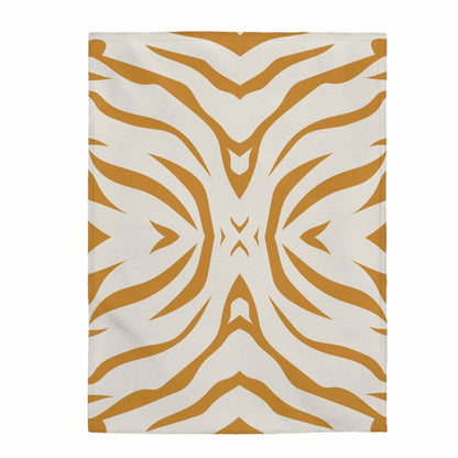 Beige throw with mustard tiger patterns